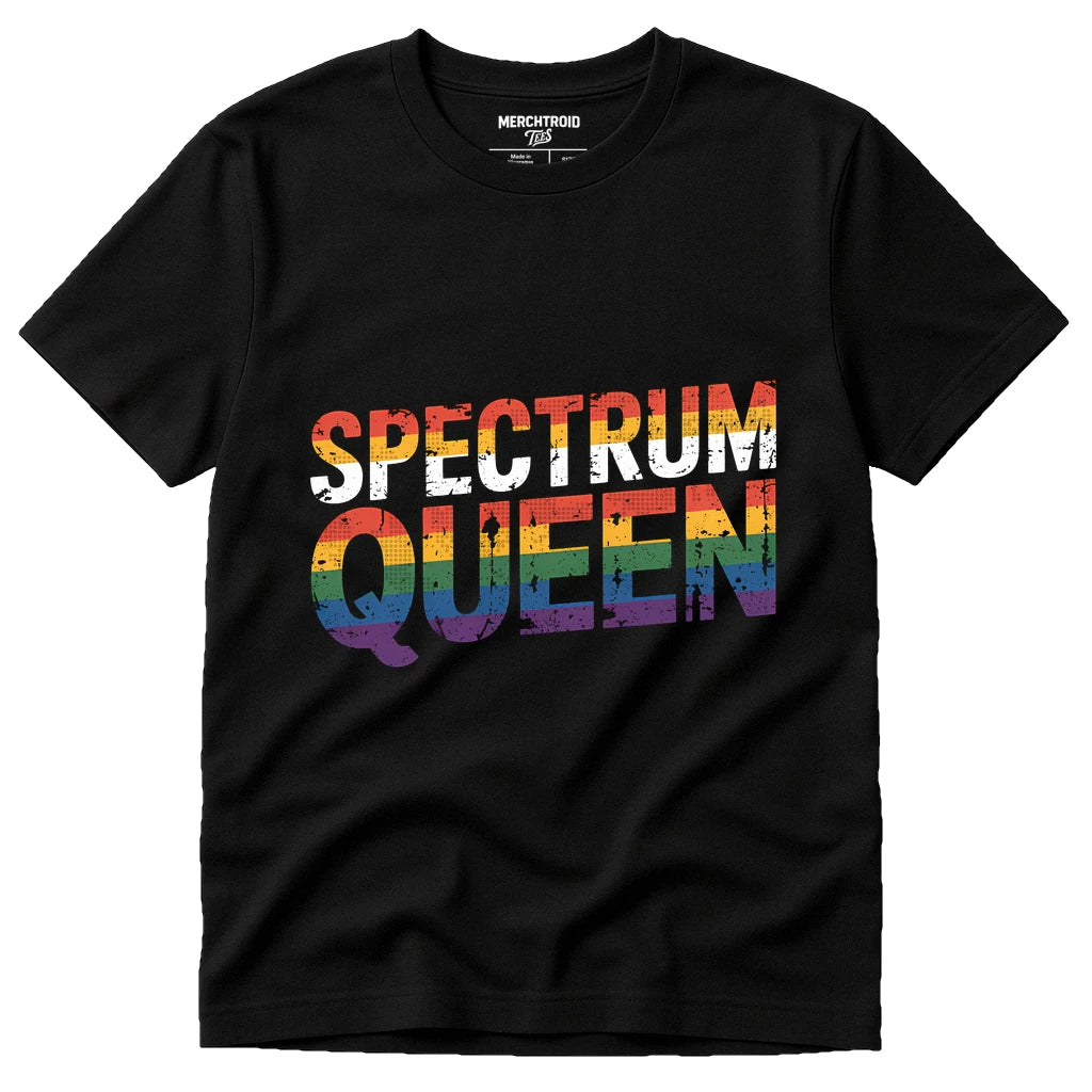 A black t-shirt with the text "SPECTRUM QUEEN" in rainbow colors, representing diversity and pride. The shirt is displayed against a plain background.
