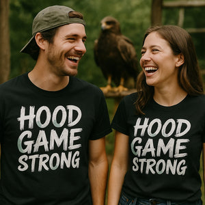 Person wearing the black falcon t shirt graphic tee - "Hood Game Strong" design