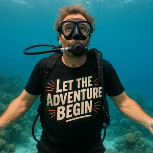 Lifestyle shot of the "Let the Adventure Begin" black adventure travel shirts in a real-world setting