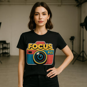 Lifestyle shot of the "Focus Pls" black photography on t shirts in a real-world setting