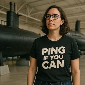 Lifestyle shot of the "Ping If You Can" black submarine tee shirts in a real-world setting
