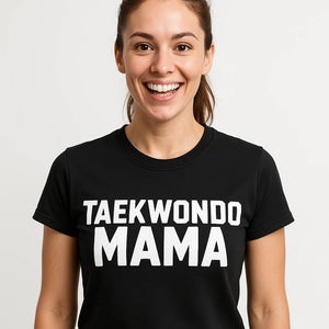 Close-up of the "Taekwondo Mama" white print on a premium Bella+Canvas black t shirt martial arts