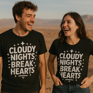 Person wearing the black stargazing t shirt graphic tee - "Cloudy Nights Break Hearts" design