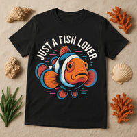 A black T-shirt featuring a colorful illustration of a clownfish with the text 