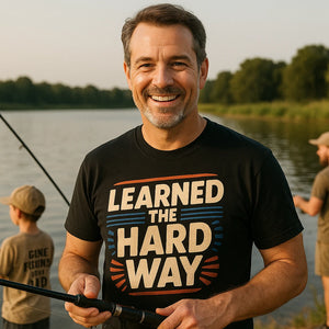 Lifestyle shot of the "Learned the Hard Way" black dad shirts in a real-world setting