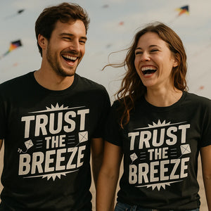 Person wearing the black kite flying t shirt graphic tee - "Trust the Breeze" design