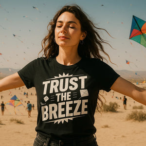 Lifestyle shot of the "Trust the Breeze" black kite flying t shirt in a real-world setting