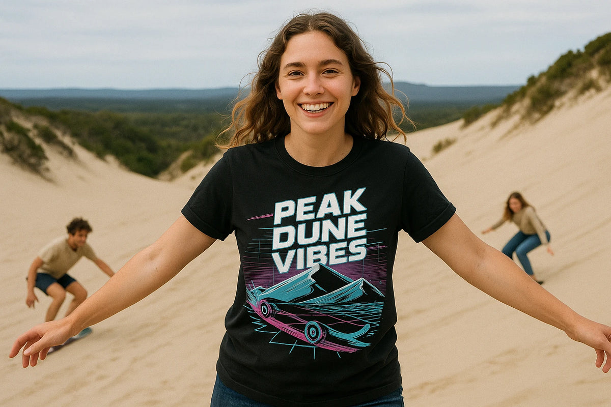 Lifestyle shot of the "Peak Dune Vibes" black sandboarding shirts in a real-world setting