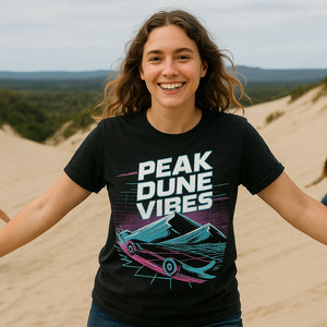Lifestyle shot of the "Peak Dune Vibes" black sandboarding shirts in a real-world setting