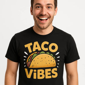 Close-up of the "Taco Vibes" gold print on a premium Bella+Canvas black taco t shirt