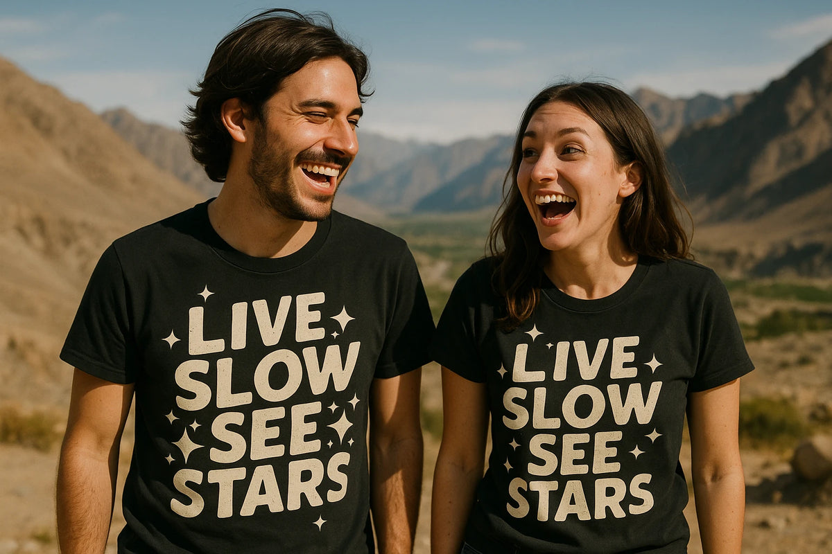 Person wearing the black stargazing t shirt graphic tee - "Live Slow See Stars" design
