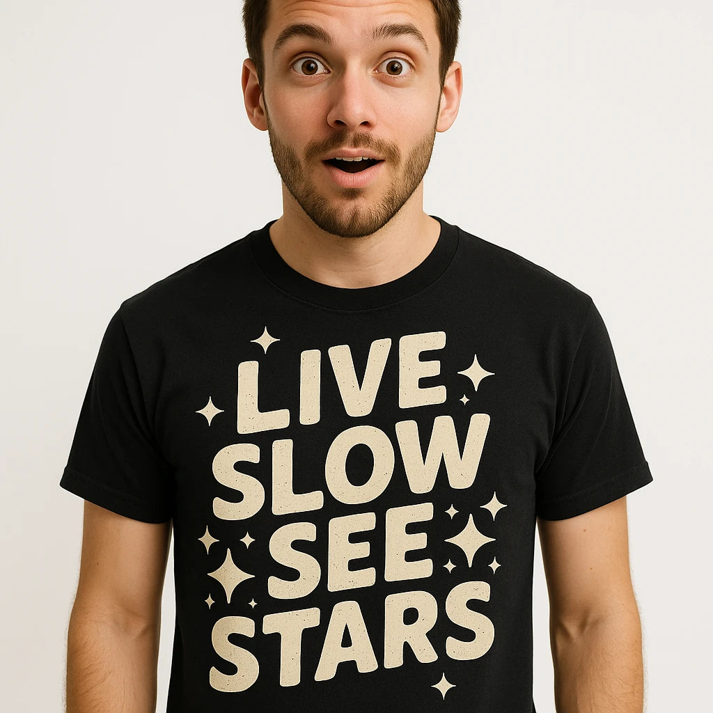 Close-up of the "Live Slow See Stars" beige print on a premium Bella+Canvas black stargazing t shirt