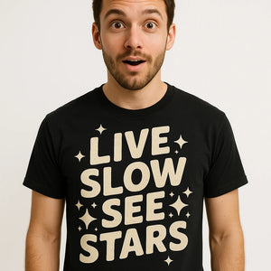 Close-up of the "Live Slow See Stars" beige print on a premium Bella+Canvas black stargazing t shirt