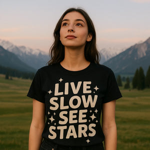 Lifestyle shot of the "Live Slow See Stars" black stargazing t shirt in a real-world setting
