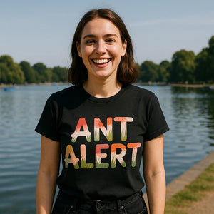 Lifestyle shot of the "Ant Alert" black picnicking t shirt in a real-world setting