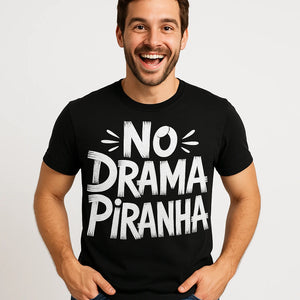 Close-up of the "No Drama Piranha" white print on a premium Bella+Canvas black piranha t shirt