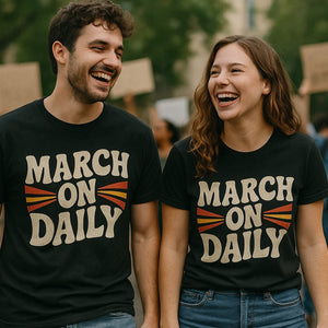 Person wearing the black activism t shirt graphic tee - "March on Daily" design