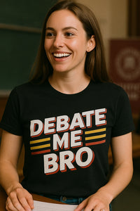 A person with long brown hair is smiling while wearing a black T-shirt with the text 