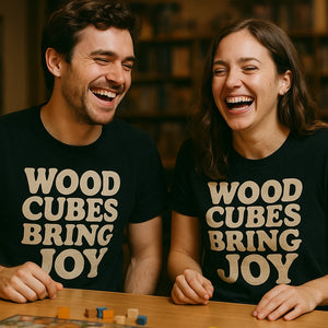 Person wearing the black board game tee shirts graphic tee - "Wood Cubes Bring Joy" design