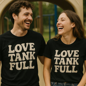 Person wearing the black cheap mom life shirts graphic tee - "Love Tank Full" design