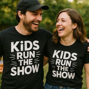 Person wearing the black family life t shirt graphic tee - "Kids Run the Show" design