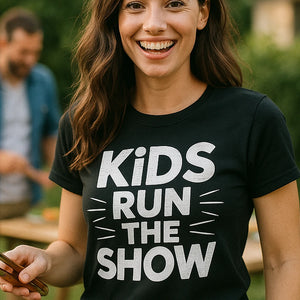 "Kids Run the Show" black family life t shirt, photographed as family life lover gift