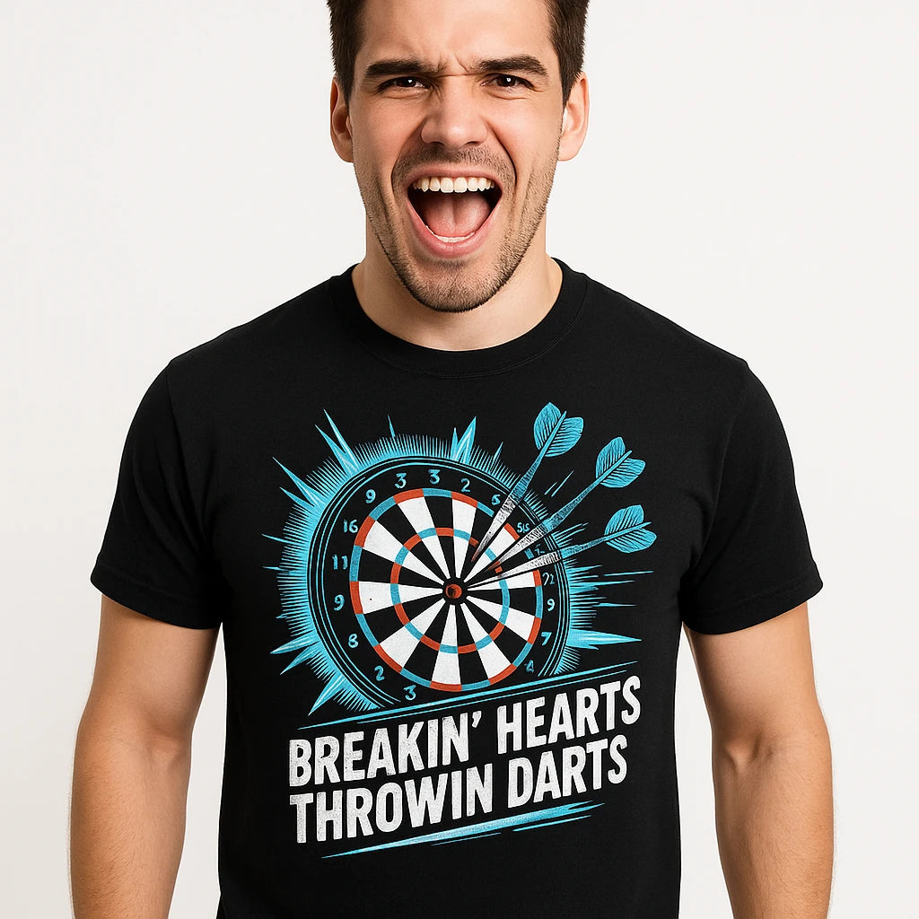 Close-up of the "Breakin' Hearts Throwin Darts" teal print on a premium Bella+Canvas black darts shirts