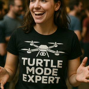 "Turtle Mode Expert" black drone t shirt, photographed as gift for drone lover
