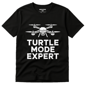 Black Drone T Shirt - "Turtle Mode Expert" graphic tee with white print, flat lay product photo
