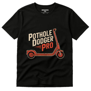 Black Electric Scooter T Shirt - "Pothole Dodger Pro" graphic tee with beige print, flat lay product photo