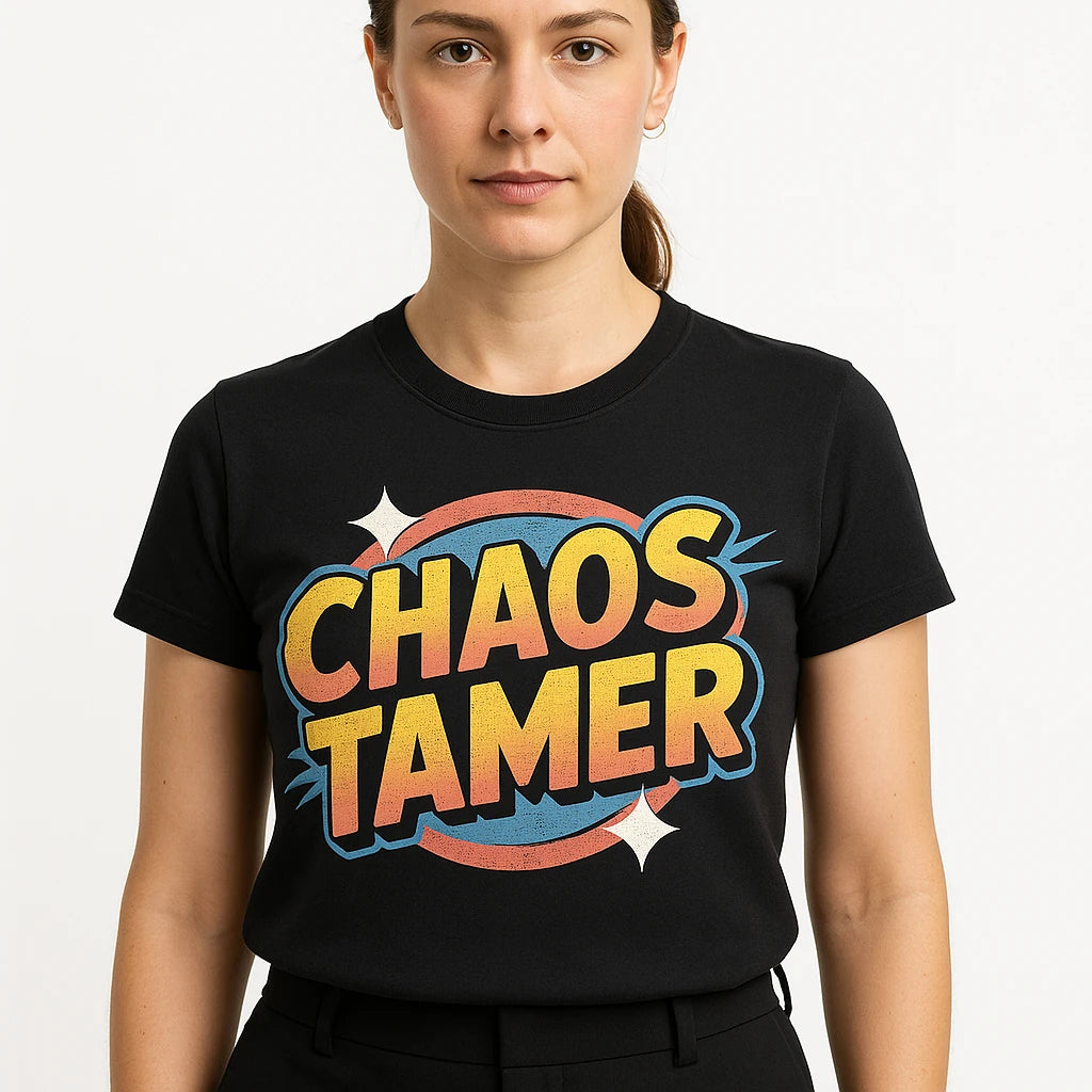 Close-up of the "Chaos Tamer" gold print on a premium Bella+Canvas black wedding planner t shirt