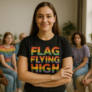 Lifestyle shot of the "Flag Flying High" black lgbtq t shirt in a real-world setting