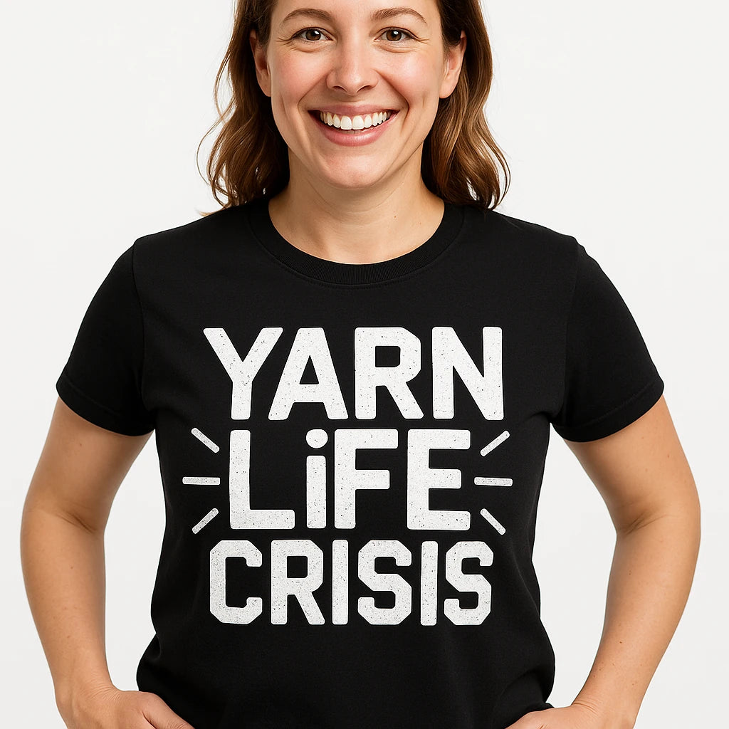Close-up of the "Yarn Life Crisis" white print on a premium Bella+Canvas black knitting shirts