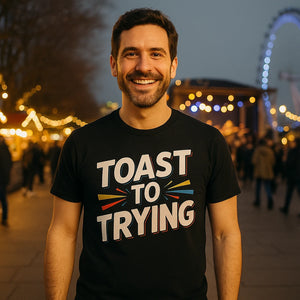 Lifestyle shot of the "Toast To Trying" black new years eve shirts in a real-world setting
