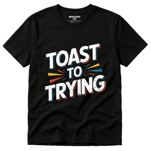 Black New Years Eve Shirts - "Toast To Trying" graphic tee with white print, flat lay product photo