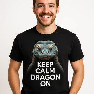 Close-up of the "Keep Calm, Dragon On" cream print on a premium Bella+Canvas black komodo dragon t shirt
