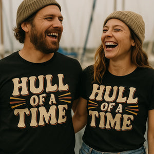 Person wearing the black boat neck t shirt graphic tee - "Hull of a Time" design
