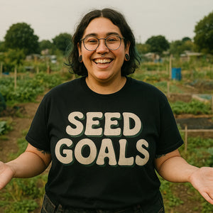 Lifestyle shot of the "Seed Goals" black gardening t shirts funny in a real-world setting