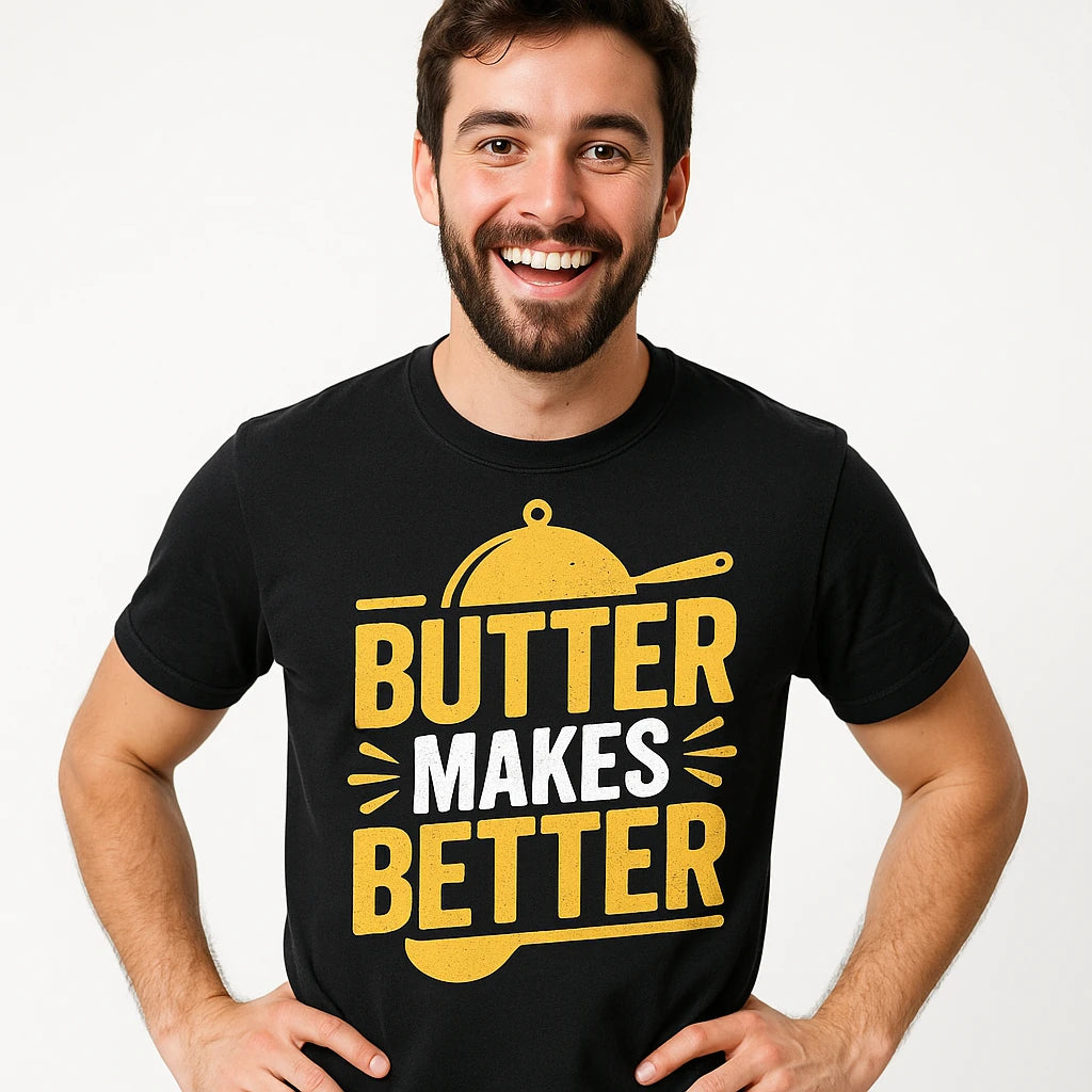 Close-up of the "Butter Makes Better" yellow print on a premium Bella+Canvas black cooking shirts