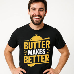 Close-up of the "Butter Makes Better" yellow print on a premium Bella+Canvas black cooking shirts