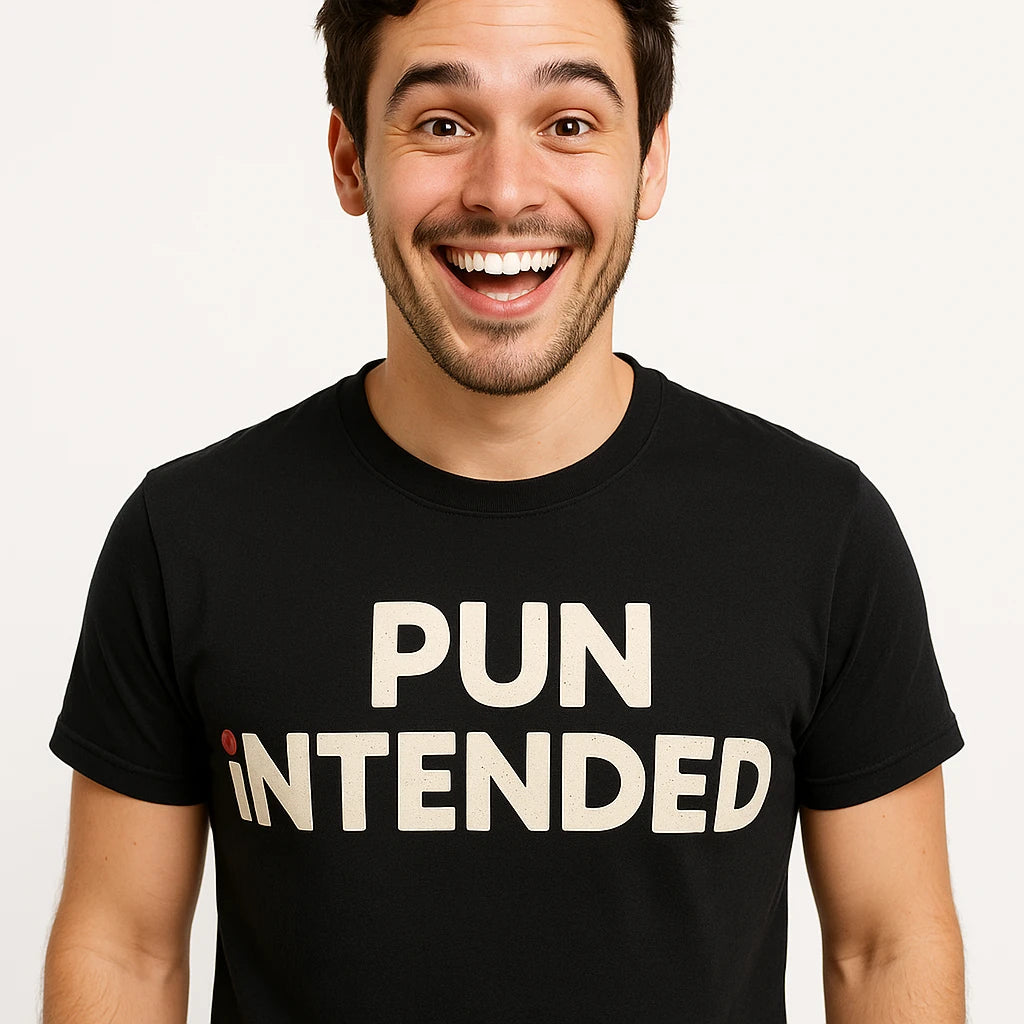 Close-up of the "Pun Intended" beige print on a premium Bella+Canvas black comedy shirts