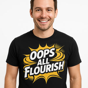 Close-up of the "Oops All Flourish" yellow print on a premium Bella+Canvas black calligraphy tees