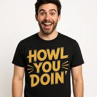A person with short dark hair and a beard is wearing a black t-shirt with the text 