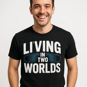 Close-up of the "Living in Two Worlds" white print on a premium Bella+Canvas black virtual reality t shirt