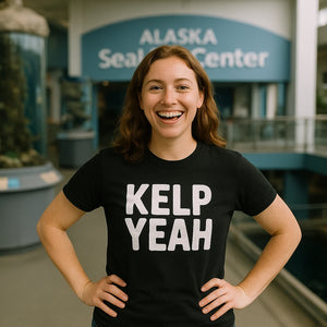 Lifestyle shot of the "Kelp Yeah" black sea otter shirts in a real-world setting