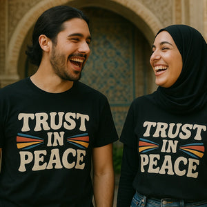 Person wearing the black love in faith t shirts graphic tee - "Trust in Peace" design