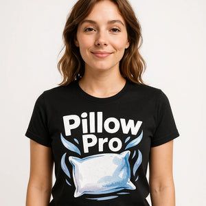 Close-up of the "Pillow Pro" white print on a premium Bella+Canvas black oversized sleep t shirt