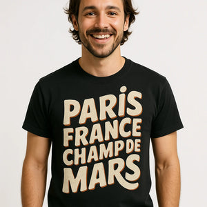 Close-up of the "Paris France Champ De Mars" beige print on a premium Bella+Canvas black paris tee shirt