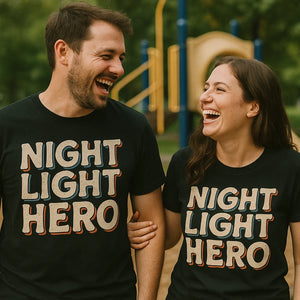 Person wearing the black new parents shirts graphic tee - "Night Light Hero" design