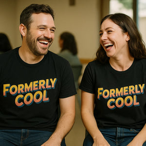 Person wearing the black parent identity crisis t shirt graphic tee - "Formerly Cool" design